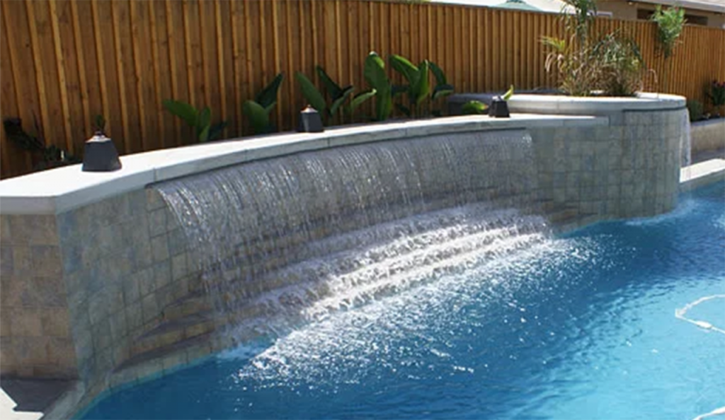 rectangle pool with rock waterfall